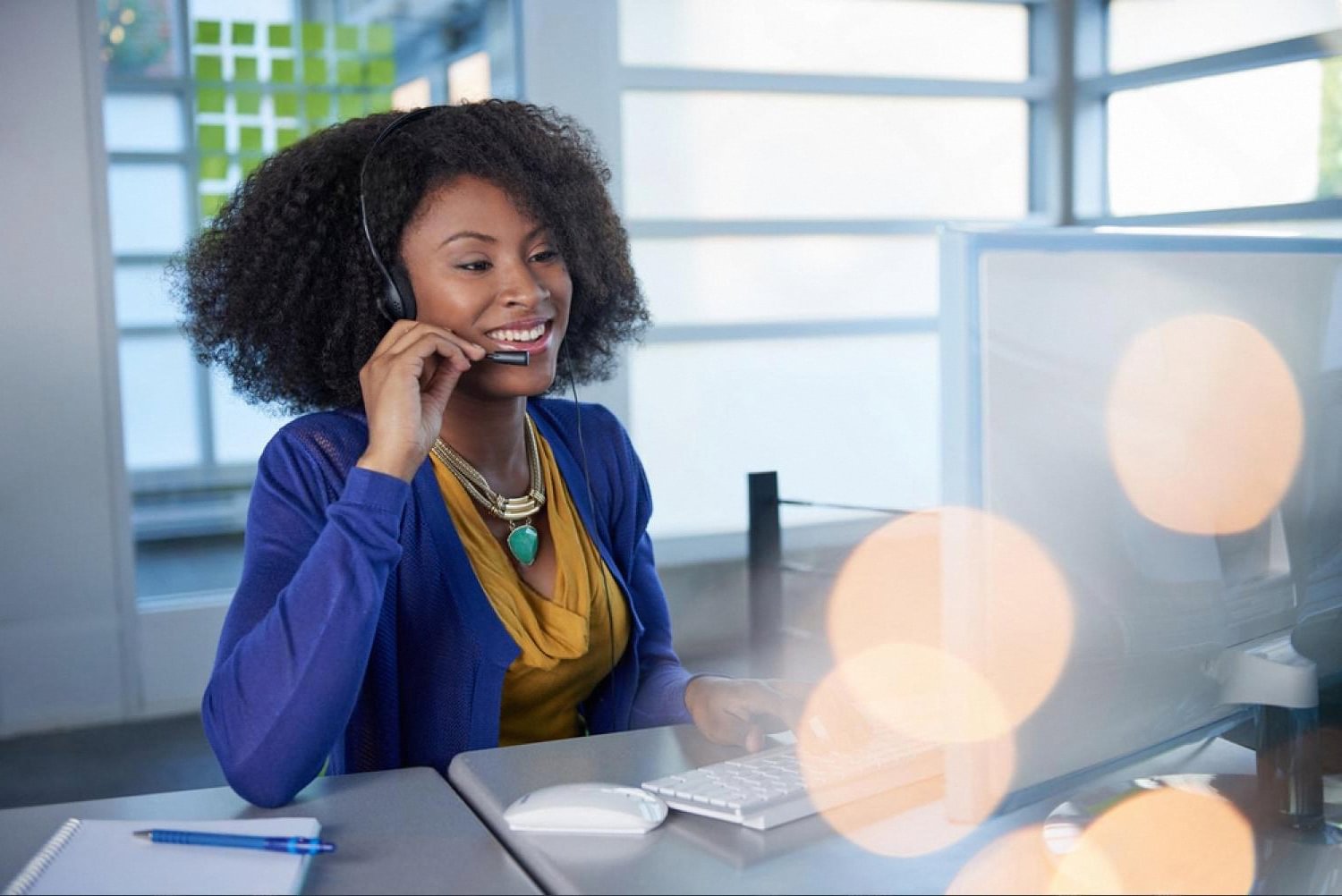 Customer support agent with headset assisting UAE customers on a call